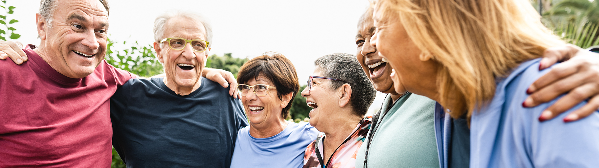 Older adults laughing together outside | Presbyterian Village Athens