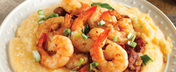 A delicious meal of shrimp and grits created at a senior living community.