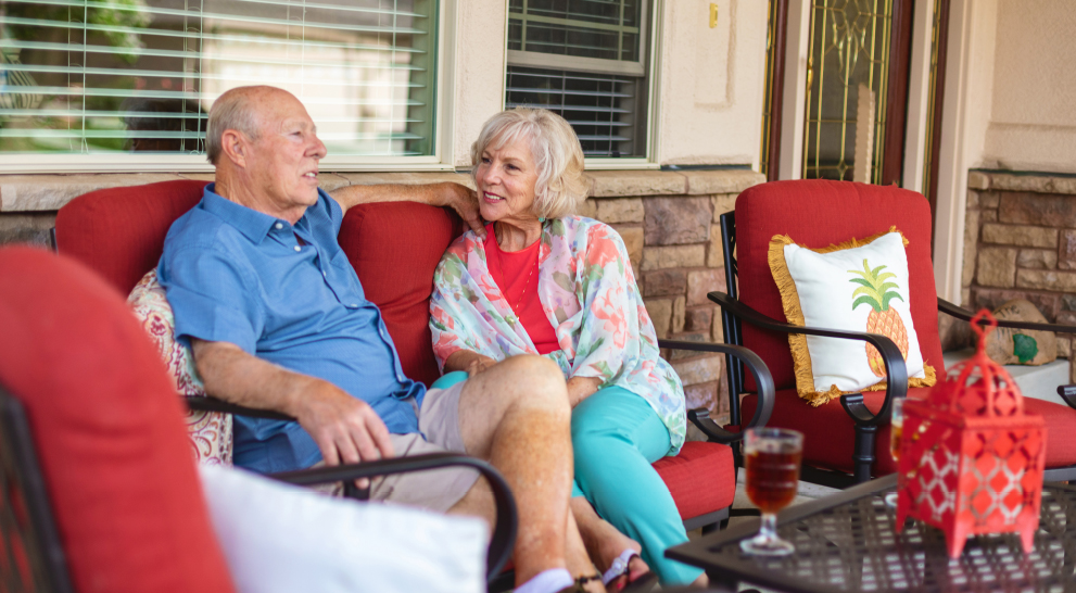 Older couple sitting outside on the patio | Presbyterian Village Athens