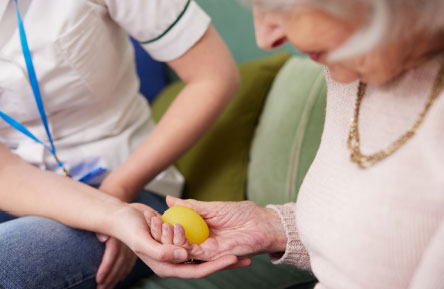 A close-up of a woman doing occupational therapy.