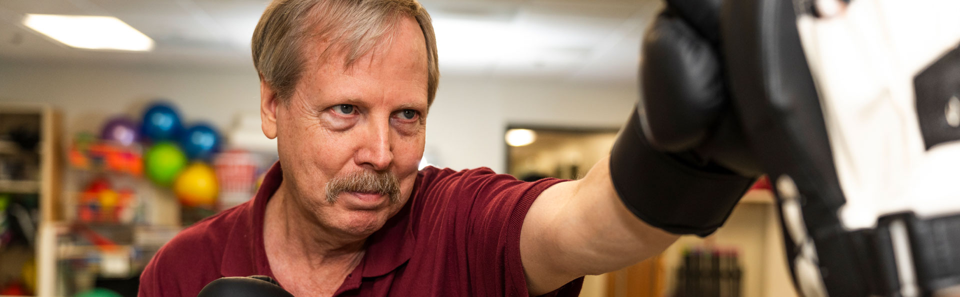 Older man boxing | Presbyterian Village Athens